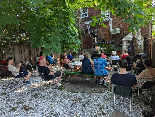 people watching soccer in garden